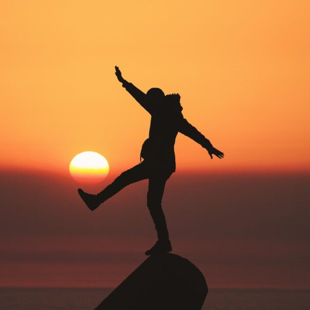 Person Balancing on a rock